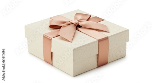 A small, square, textured gift box with a pale cream hue is adorned with a soft pink ribbon tied in a bow, sitting on a white background