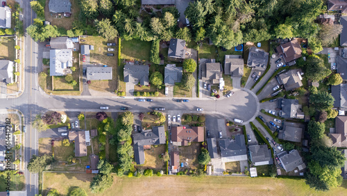 Aerial view captured by drone showing rural houses on a residential cul-de-sac street 