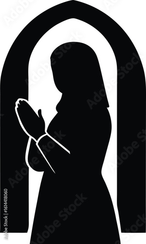 Silhouette of a devout Muslim woman in a hijab praying inside an arched window frame