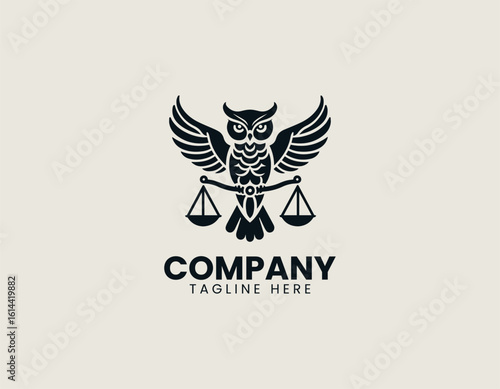 Majestic golden owl with outstretched wings holding scales of justice on a dark background. Legal concept