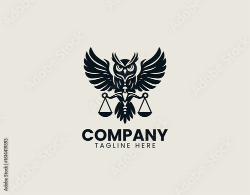 Majestic golden owl with outstretched wings holding scales of justice on a dark background. Legal concept