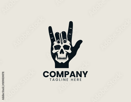 Bold black rock and roll hand gesture with skull incorporated into the design. Music subculture concept