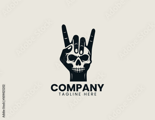 Bold black rock and roll hand gesture with skull incorporated into the design. Music subculture concept