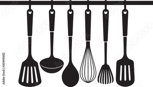 Kitchen utensils hanging on a rack in silhouette