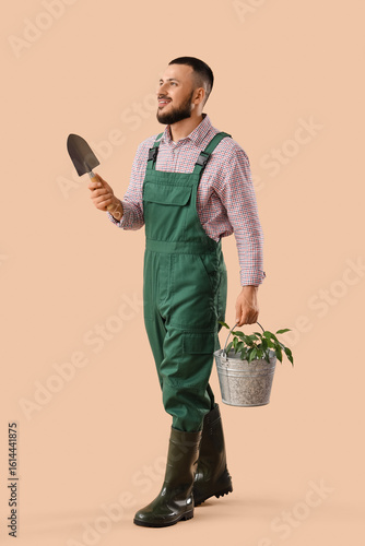 Male gardener with plant an...
