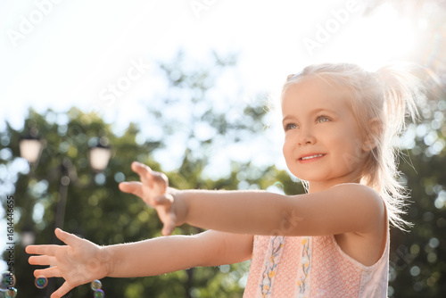 Cute little girl with soap ...