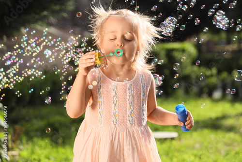 Cute little girl blowing so...
