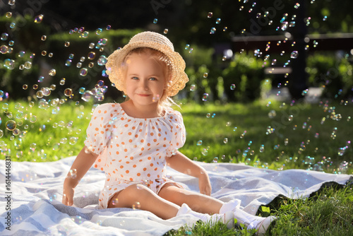 Cute little girl with soap ...