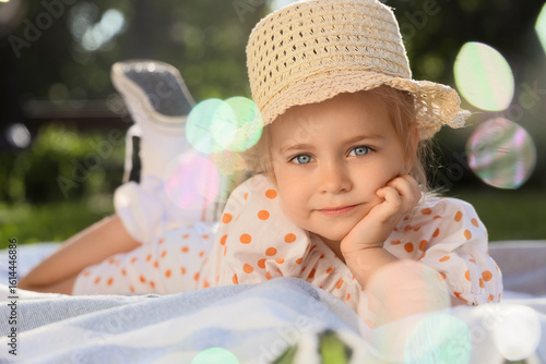 Cute little girl lying on p...
