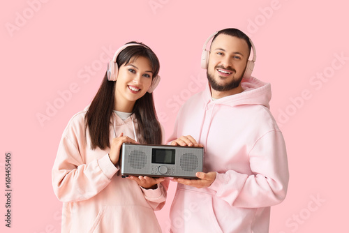 Young couple in headphones ...