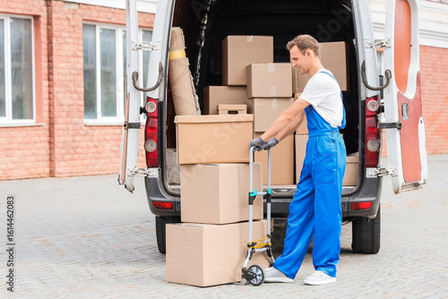 Male mover unloading boxes ...