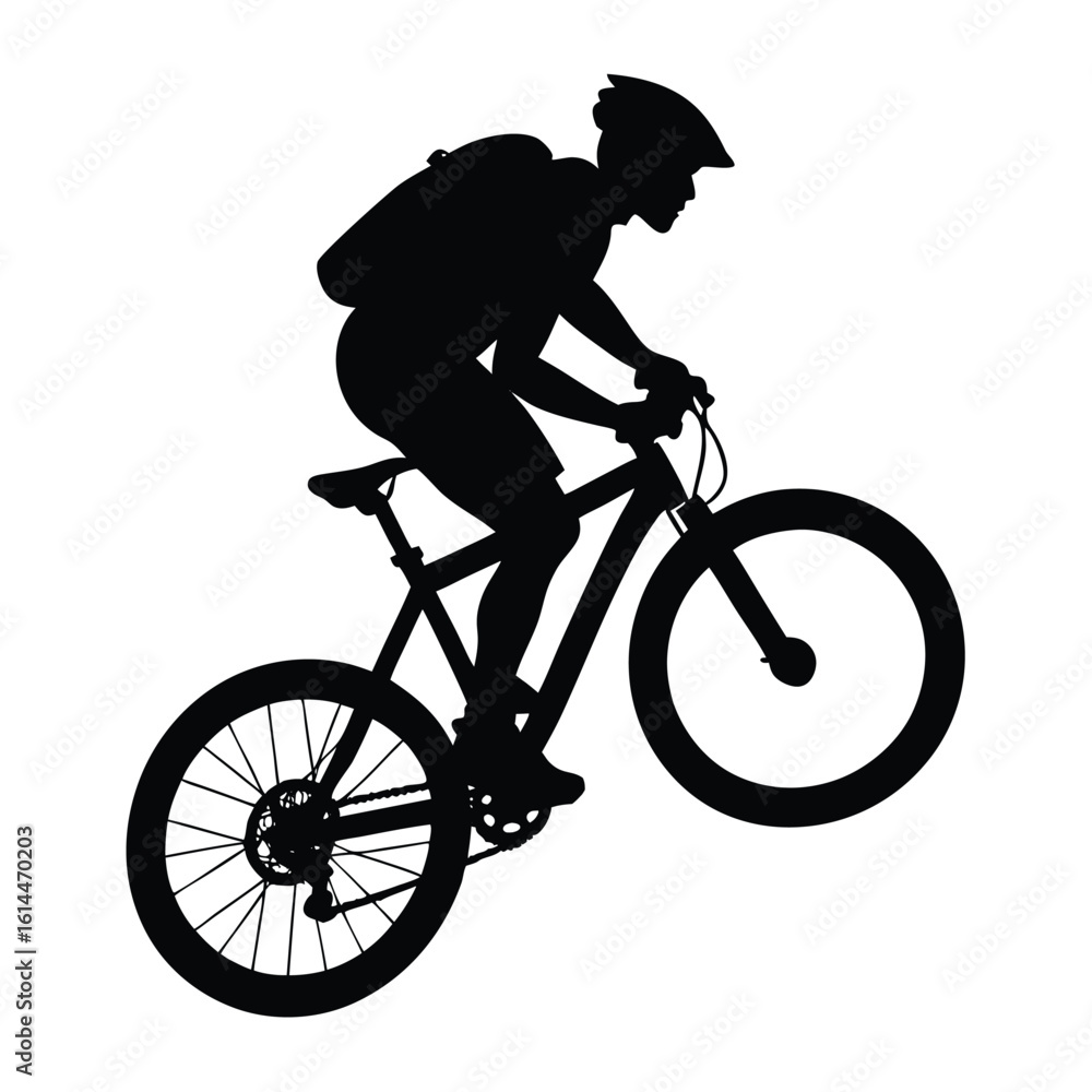 Fototapeta premium Cyclist silhouette performing a wheelie bicycle black