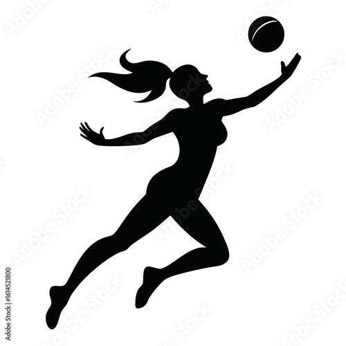 Silhouette of a female volleyball player in action reaching for the ball during a game