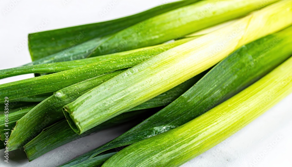 Close-up of fresh green leeks showcasing vibrant colors and natural texture, ideal for culinary, health, and organic food themes. Close-up of fresh green leeks showcasing vibrant colors and natural texture, ideal for culinary, health, and organic food themes.