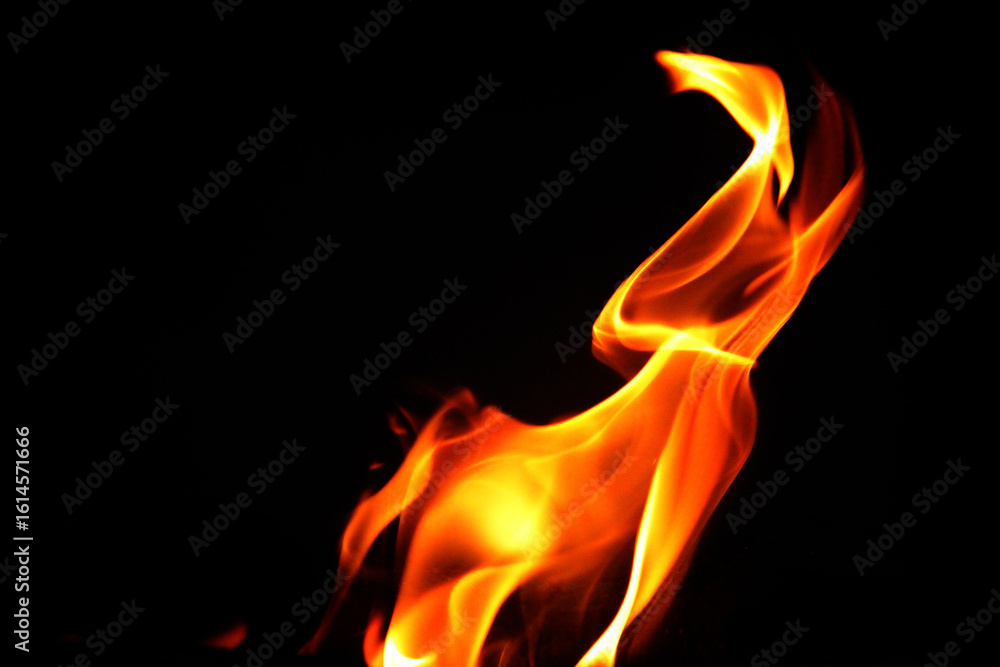 Fototapeta premium Close up burning flames on black background for graphic design or wallpaper.