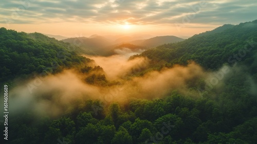 Misty mountain sunrise view from above