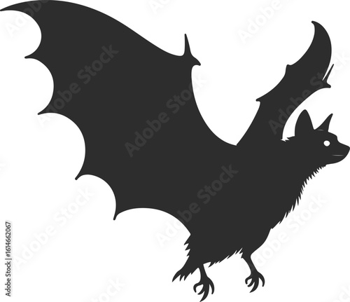 Silhouette of a bat in flight with wings spread wide
