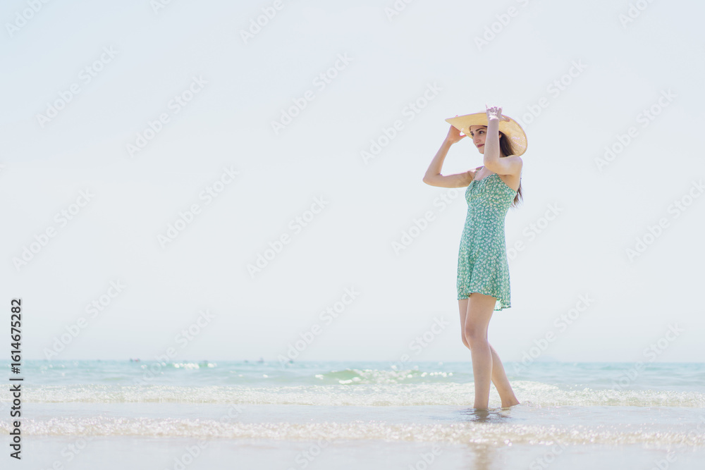 Caucasian beautiful woman enjoy relaxing and walking along the beach, reflecting on summer activities. Caucasian beautiful woman enjoy relaxing and walking along the beach, reflecting on summer activities.