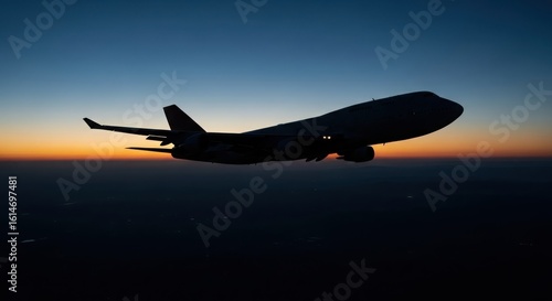 Majestic airplane soaring through a vibrant sunset sky creating a dramatic silhouette