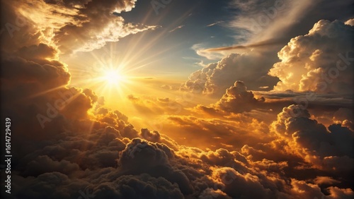 Golden sunburst illuminating dramatic fiery clouds at sunrise or sunset
