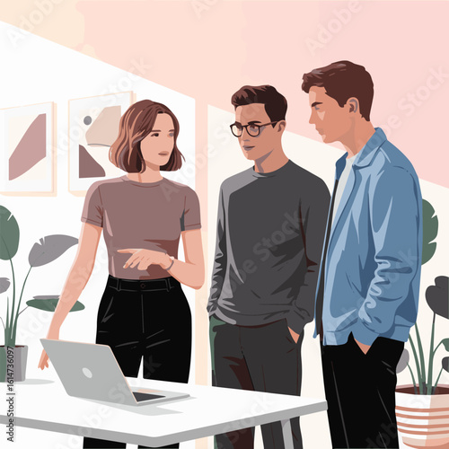 Three people discussing something in front of a laptop on a white table in a bright office space