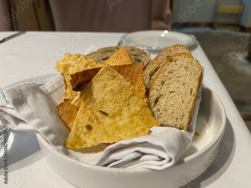 a basket of some bread as a appetizer