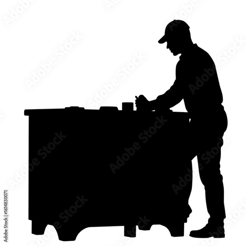 Silhouette of worker adjusting control knobs on stove – User experience enhancement