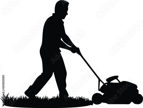 Silhouette of a man mowing grass with a lawn mower