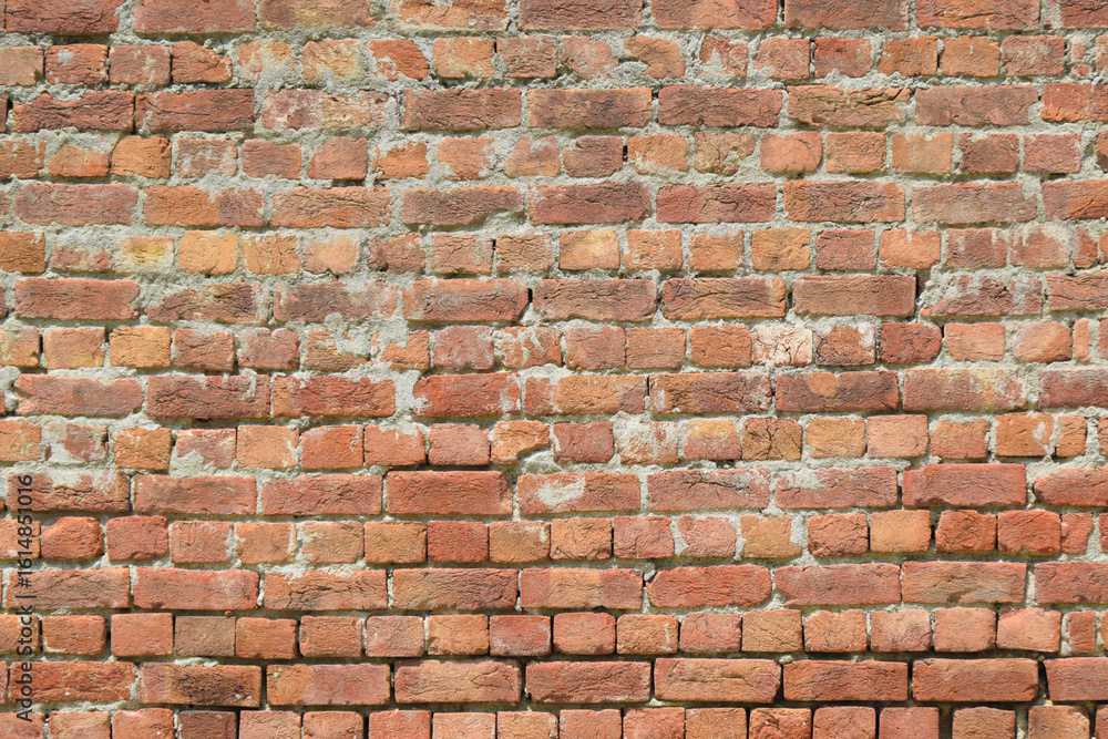 Fototapeta premium brick wall old red brick wall with dust and debris on white background. Broken brick wall with scattered debris and visible cracks.