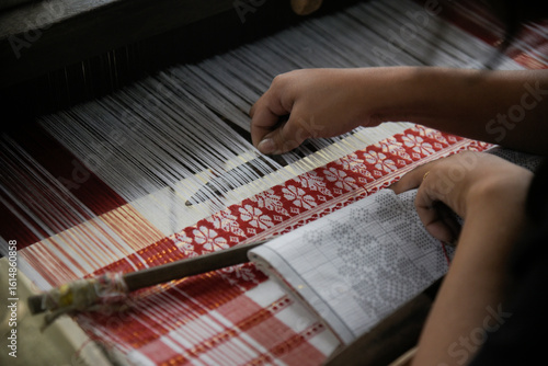 weaving Assamese traditional Gamosa during Bihu festival