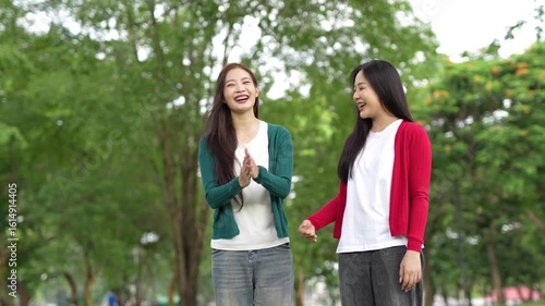 A couple holding hands in a park