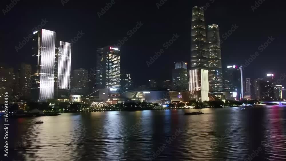 Night cityscape, river reflection, illuminated skyscrapers, boat, China Night cityscape, river reflection, illuminated skyscrapers, boat, China