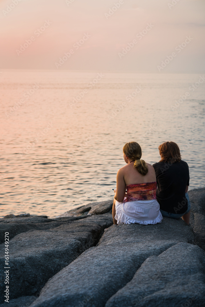 Fototapeta premium Romantic Couple Watching Sunset on Thai Beach