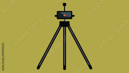 Digital camera with a lens on a tripod stand, an isolated photography equipment object for studio photographer
