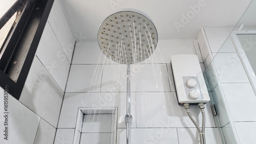 Overhead Rain Shower with Water Heater in Bathroom.