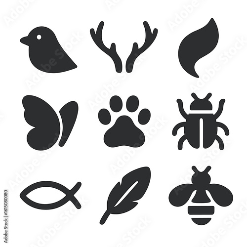 Animal Icon Grid. Solid, filled icon set of animal-inspired minimalism: bird outline, deer antler, fox tail, butterfly wing, paw