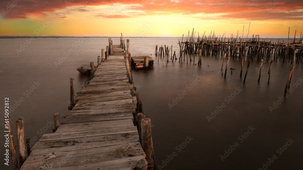 Fototapeta premium Old fishing pier - Carrasqueira Comporta Palafítico Pier - The Carrasqueira Comporta Palafítico Pier is a place known as an architectural masterpiece. Travel concept.