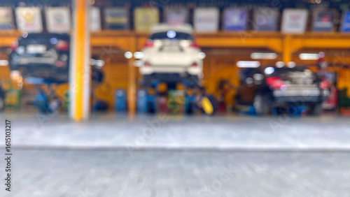 Wallpaper Mural Blurry car repair shop, the car is being serviced in a garage Torontodigital.ca