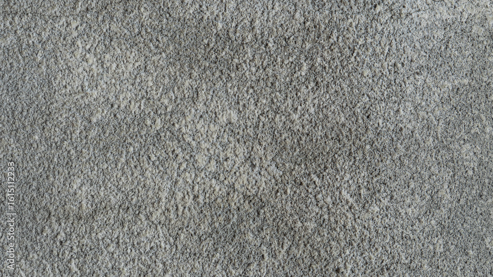 Fototapeta premium Abstract grey textured background showing a rough grainy surface. Excellent for minimalist designs, backdrops or to add subtle depth.