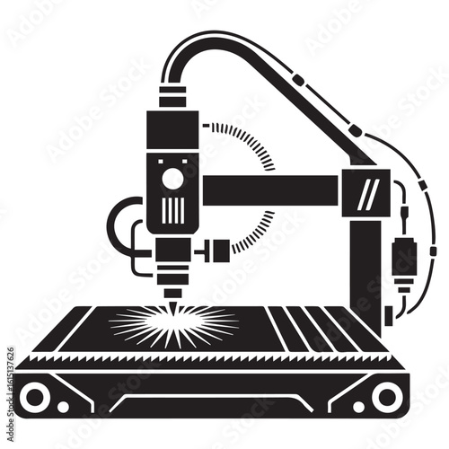Silhouette of a laser engraving machine in action cutting a design onto a surface with a bright beam of light