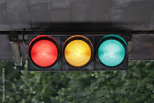 Horizontal traffic light with all lights illumanated.