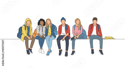 A diverse group of young students sitting together enjoying their free time outdoors