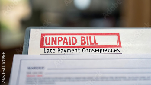 Financial awareness campaign promotes saving. Unpaid bill notice with a warning about late payment consequences displayed prominently.