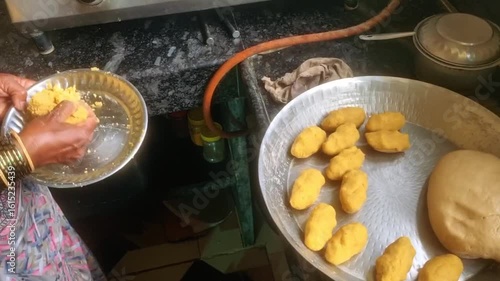 Puran Poli is a traditional Indian sweet flatbread, particularly popular in Maharashtra, made by stuffing a sweet lentil filling (puran) into a soft dough (poli).several flattened, round dough portion