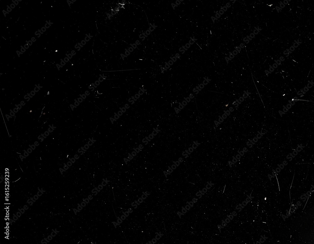 Fototapeta premium Overlay texture emulating old 8mm film with floating dust particles, hairline scratches, and occasional flicker. Black background with transparent film effects suitable for vintage and retro-style
