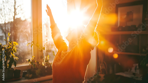 Person stretches arms towards warm sunlight streaming through a window.  Sunlight highlights the silhouette of the person, who appears happy and energized. Plants are visible in the foreground