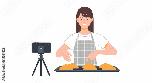 Smiling young woman in an apron filming a culinary tutorial with a smartphone on a tripod, demonstrating food preparation on a baking sheet.
