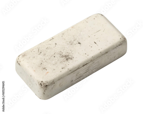 A rectangular white rubber eraser slightly dirty and used sits isolated against a clean transparent