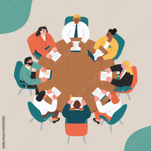 Diverse group of professionals collaborate around a round table during a meeting