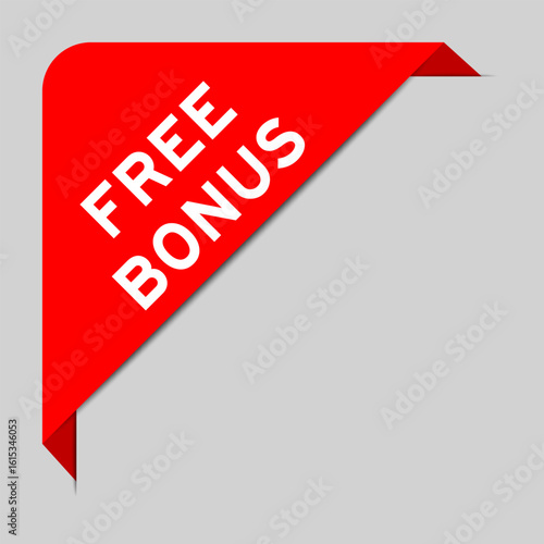 Red color of corner label banner with word free bonus on gray background